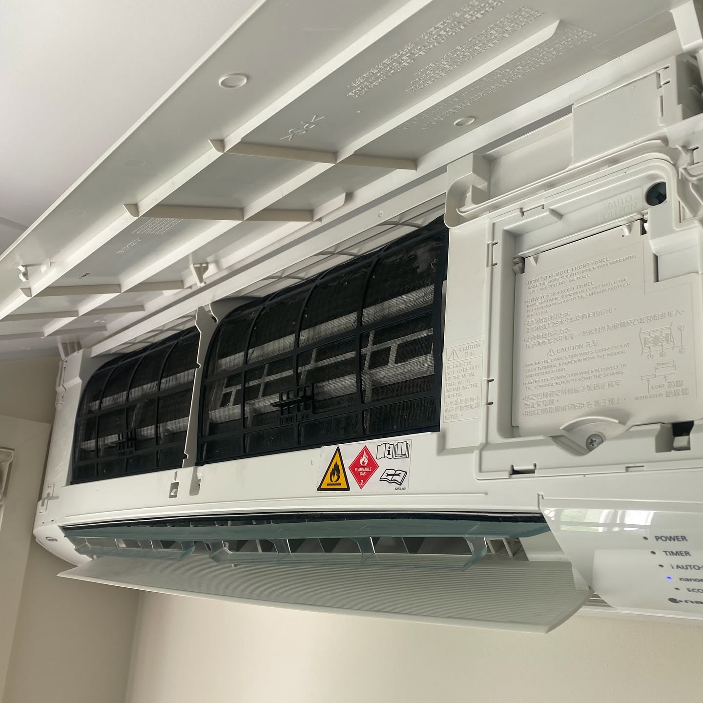 A split system with its cover lifted after a clean